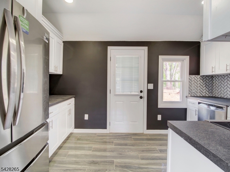 4 Emmans Road Ledgewood, NJ 07852 - Photo 15 of 25 a kitchen with a refrigerator and a sink