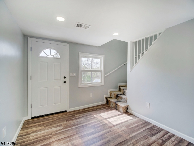 4 Emmans Road Ledgewood, NJ 07852 - Photo 6 of 25 a view of an empty room with wooden floor and a window