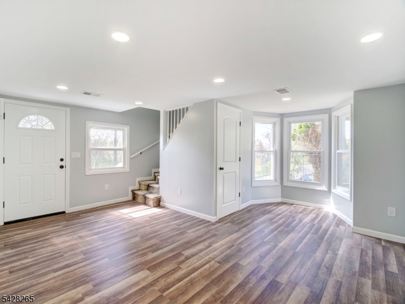 4 Emmans Road Ledgewood, NJ 07852 - Photo 8 of 25 a view of an empty room with wooden floor and a window