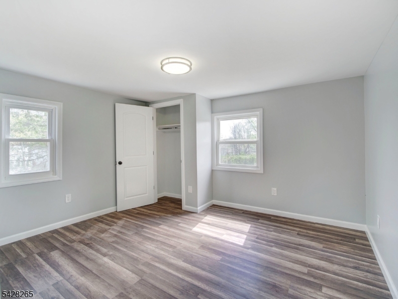 4 Emmans Road Ledgewood, NJ 07852 - Photo 9 of 25 a view of empty room with wooden floor and fan