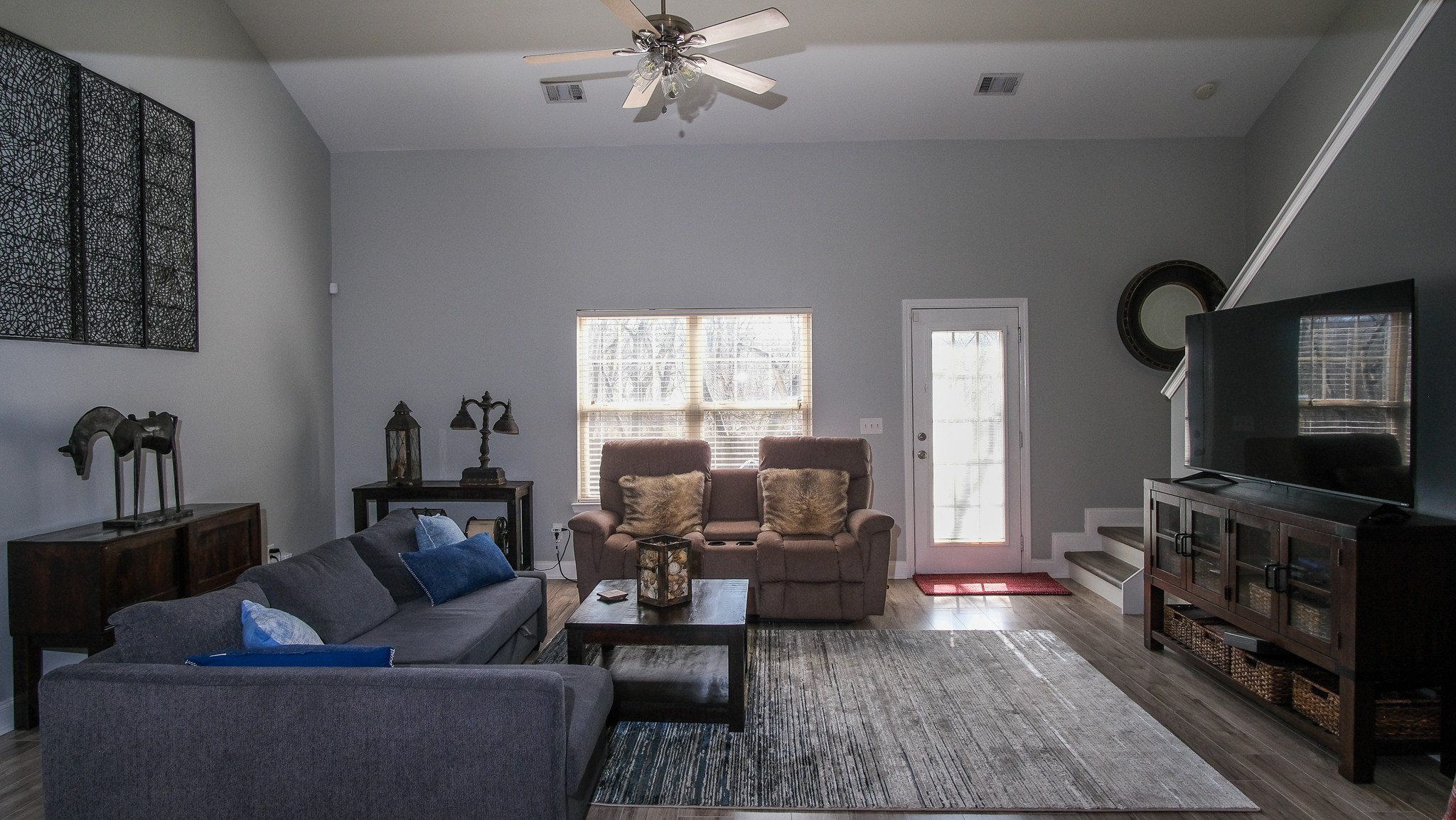 735 Tulip Grove Road, Unit 122 Hermitage, TN 37076 - Photo 12 of 39 a living room with furniture and a flat screen tv