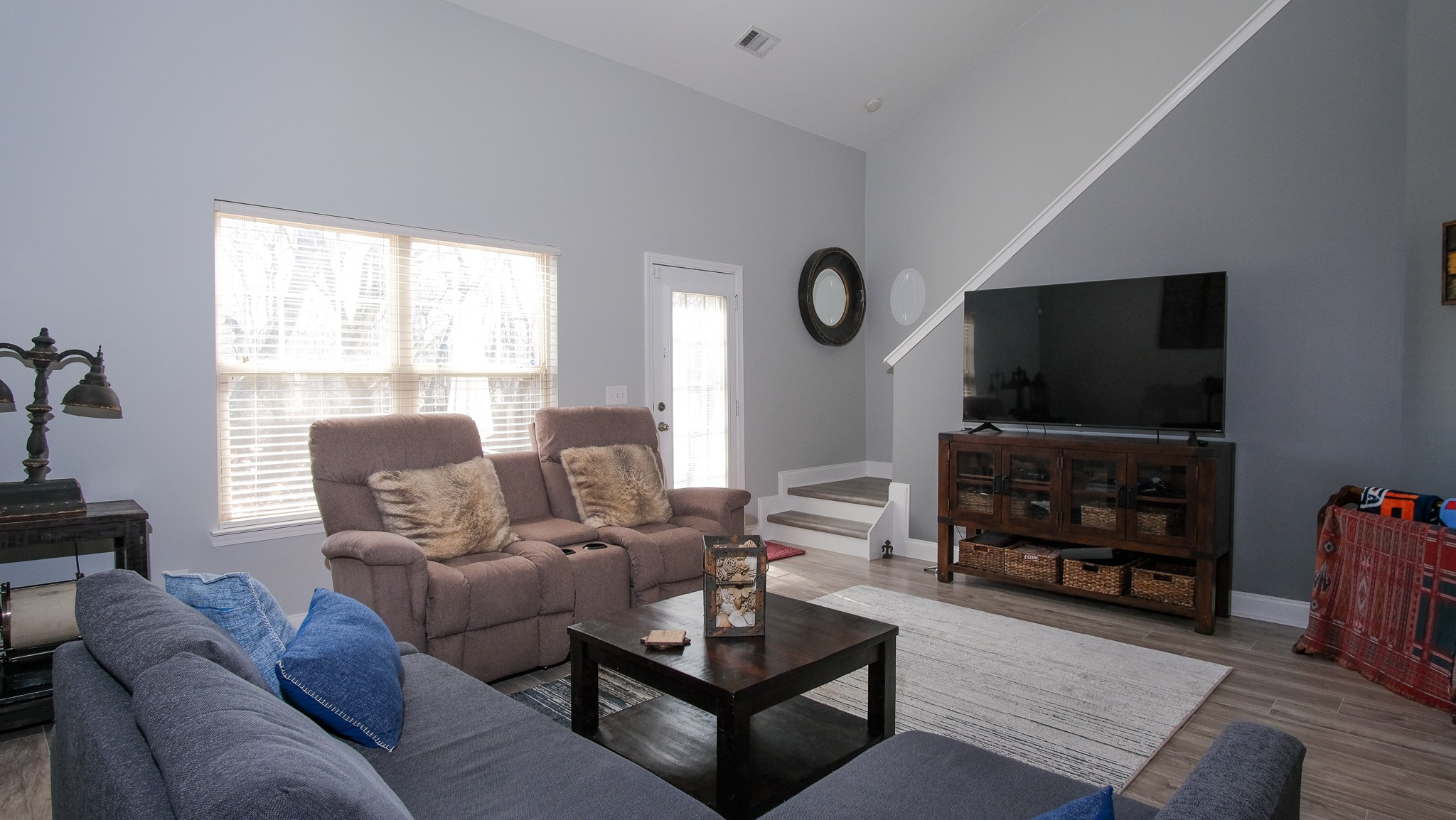 735 Tulip Grove Road, Unit 122 Hermitage, TN 37076 - Photo 13 of 39 a living room with furniture and a flat screen tv