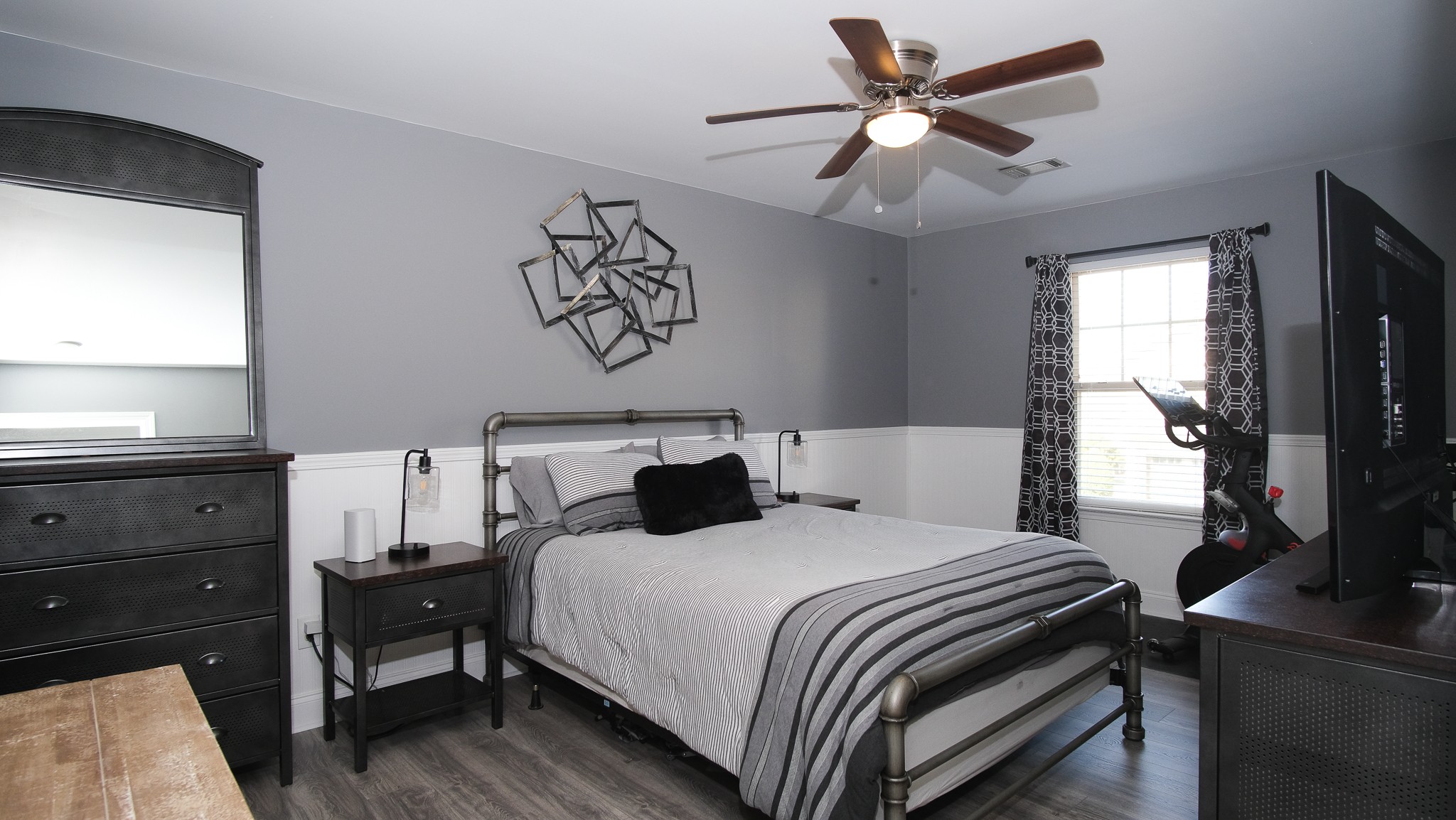 735 Tulip Grove Road, Unit 122 Hermitage, TN 37076 - Photo 21 of 39 a bedroom with a bed and a flat tv screen on the dresser
