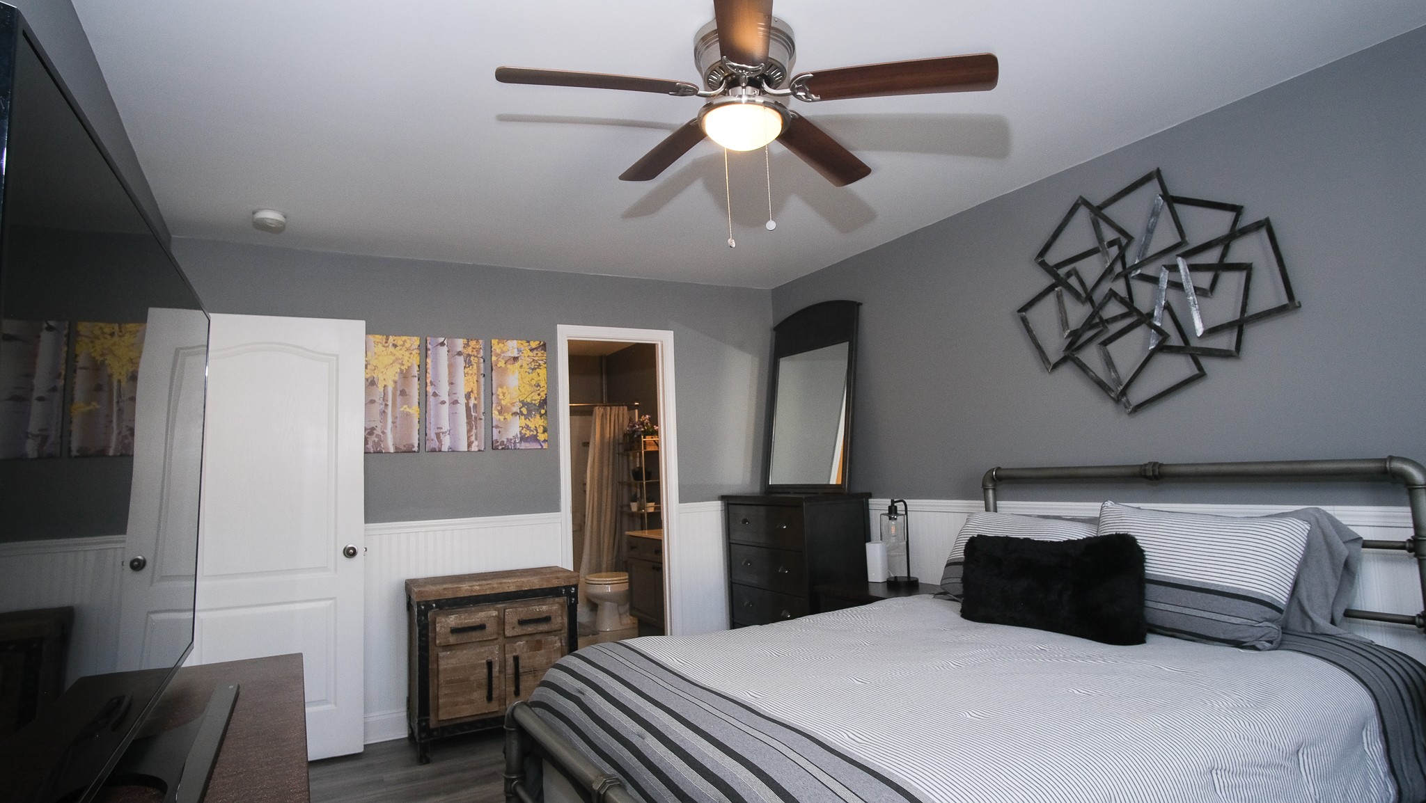 735 Tulip Grove Road, Unit 122 Hermitage, TN 37076 - Photo 22 of 39 a bedroom with a bed and a chandelier