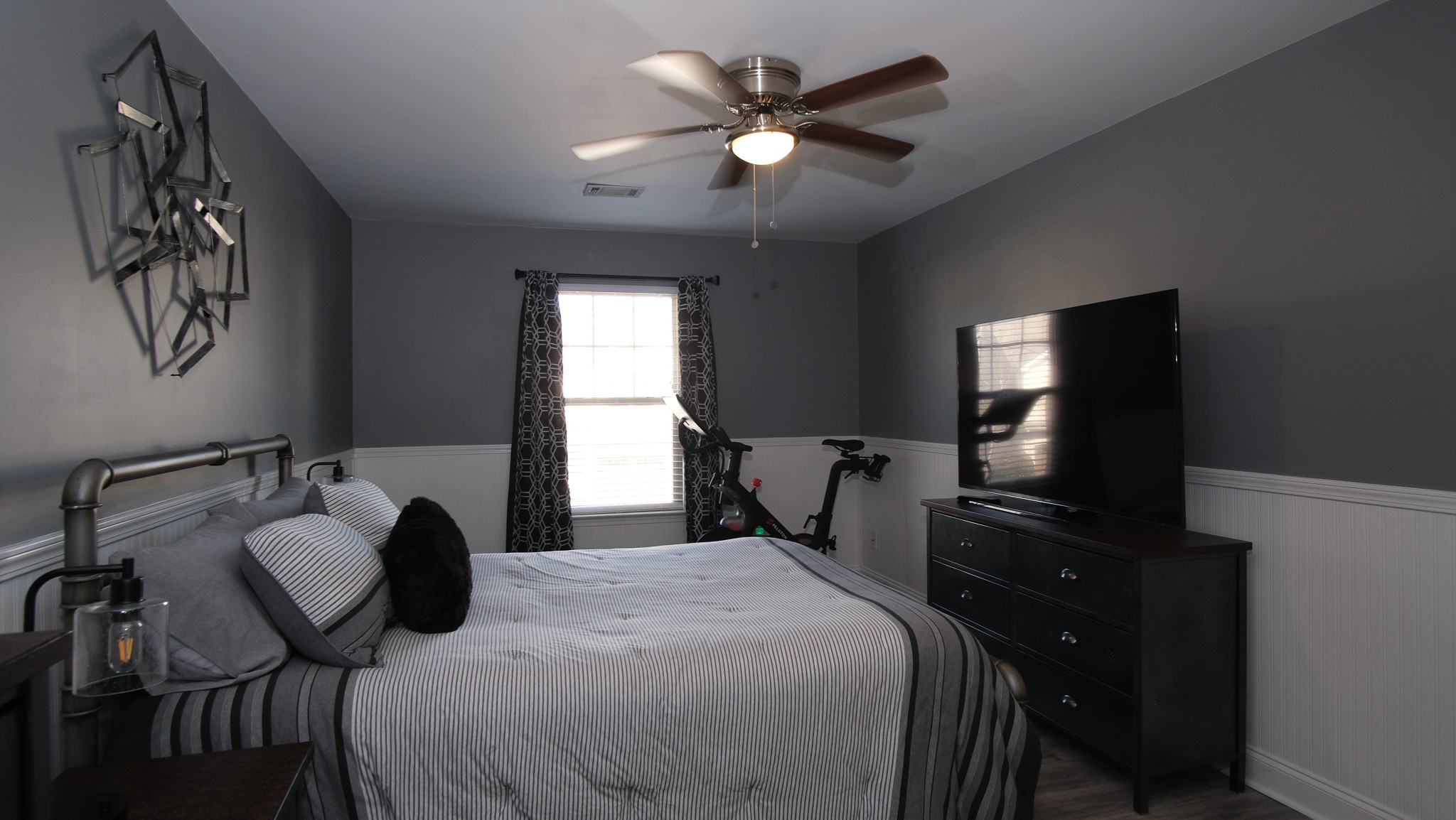 735 Tulip Grove Road, Unit 122 Hermitage, TN 37076 - Photo 23 of 39 a bedroom with a bed and a flat screen tv
