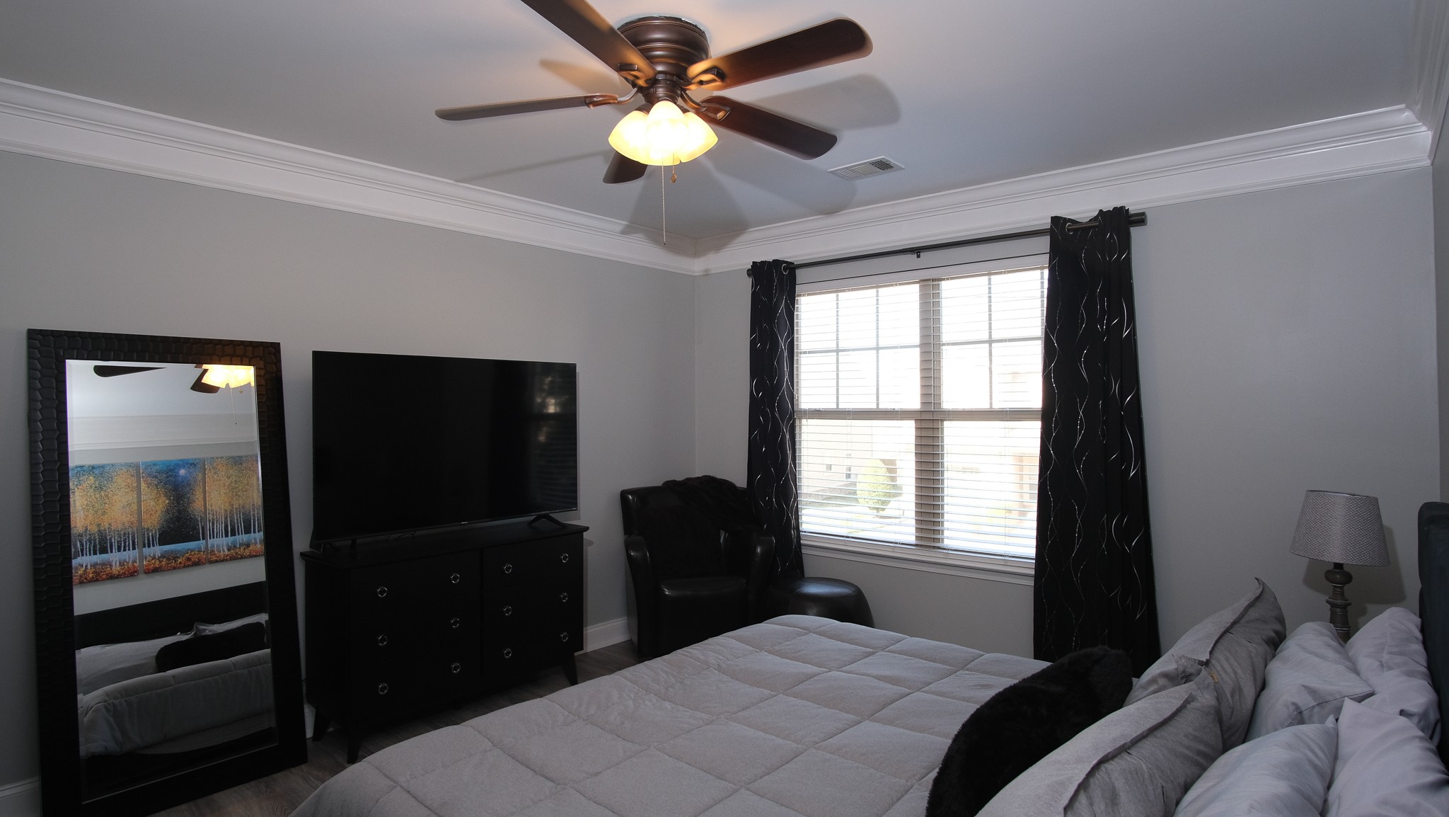 735 Tulip Grove Road, Unit 122 Hermitage, TN 37076 - Photo 28 of 39 a bedroom with a bed and a television