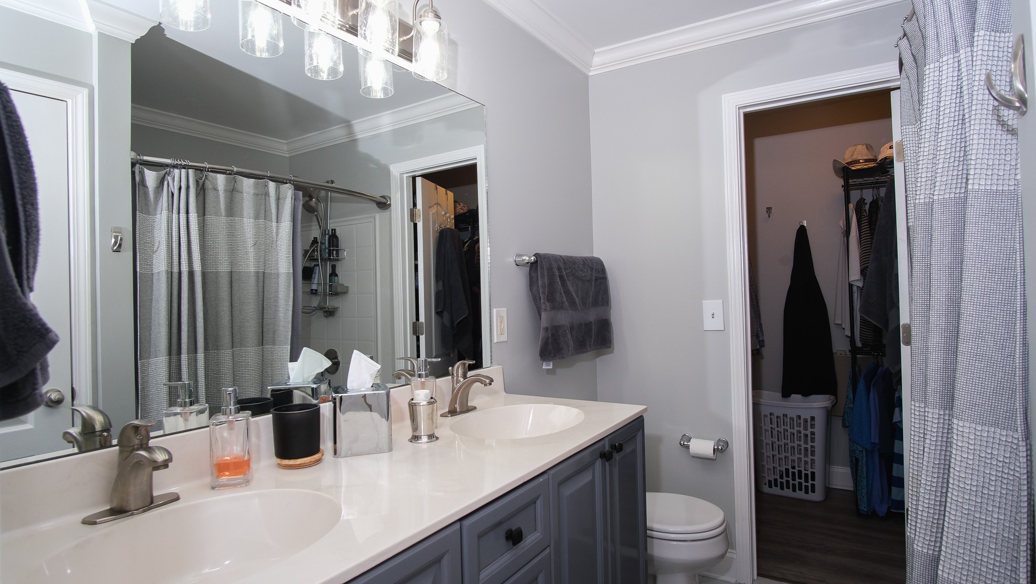735 Tulip Grove Road, Unit 122 Hermitage, TN 37076 - Photo 29 of 39 a bathroom with a double vanity sink toilet and mirror
