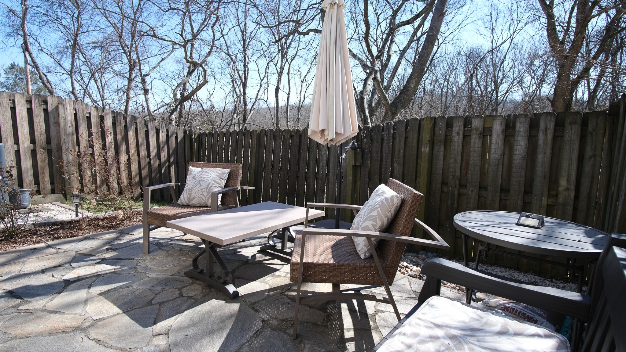 735 Tulip Grove Road, Unit 122 Hermitage, TN 37076 - Photo 32 of 39 a view of a patio with a table and chairs