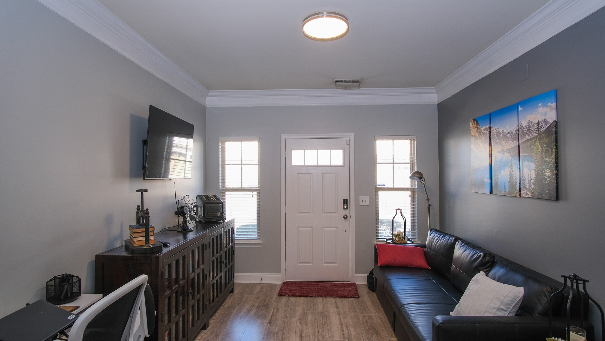 735 Tulip Grove Road, Unit 122 Hermitage, TN 37076 - Photo 6 of 39 a living room with furniture and a flat screen tv
