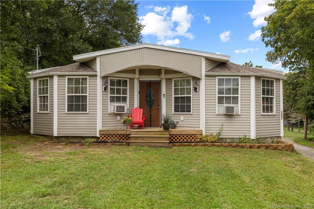 a view of a house with a yard