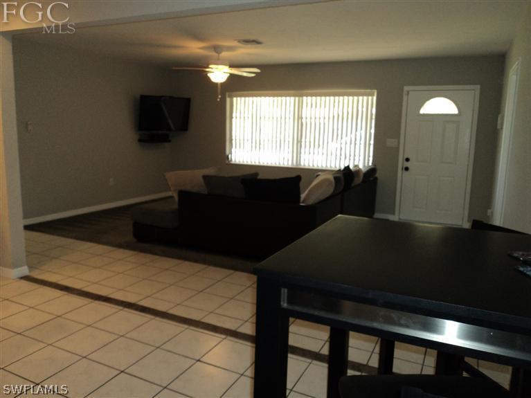 2120 Lotus Road Fort Myers, FL 33905 - Photo 2 of 15 a living room with furniture and a flat screen tv