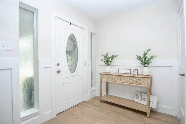 a view of living room with furniture and wooden floor