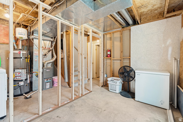 843 Deer Flat Road Tooele, UT 84074 - Photo 24 of 27 Unfinished basement area featuring exposed wood framing and concrete flooring