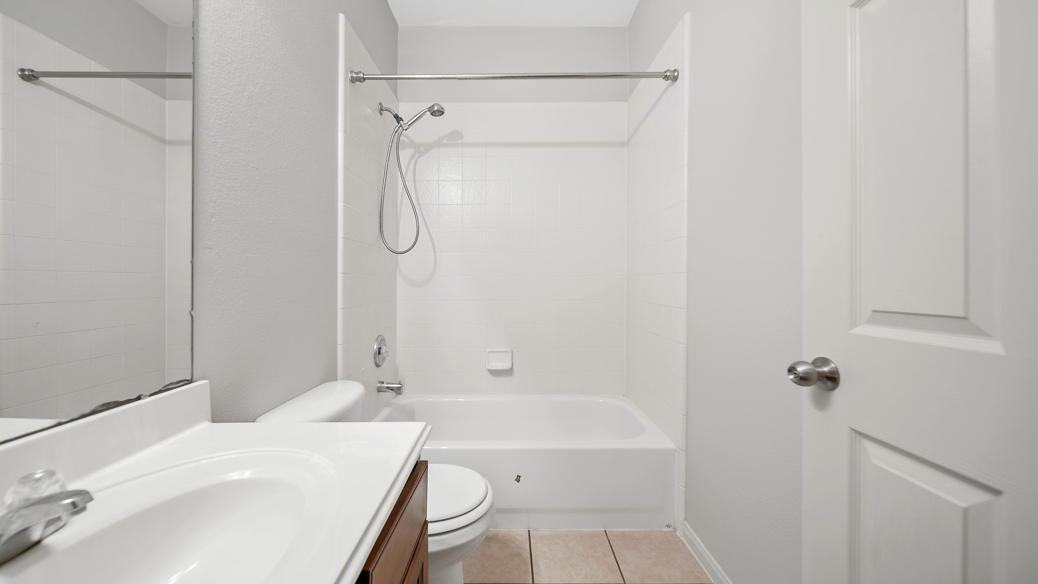 15710 Flagstone Walk Way Houston, TX 77049 - Photo 20 of 27 a bathroom with a granite countertop sink a toilet and shower