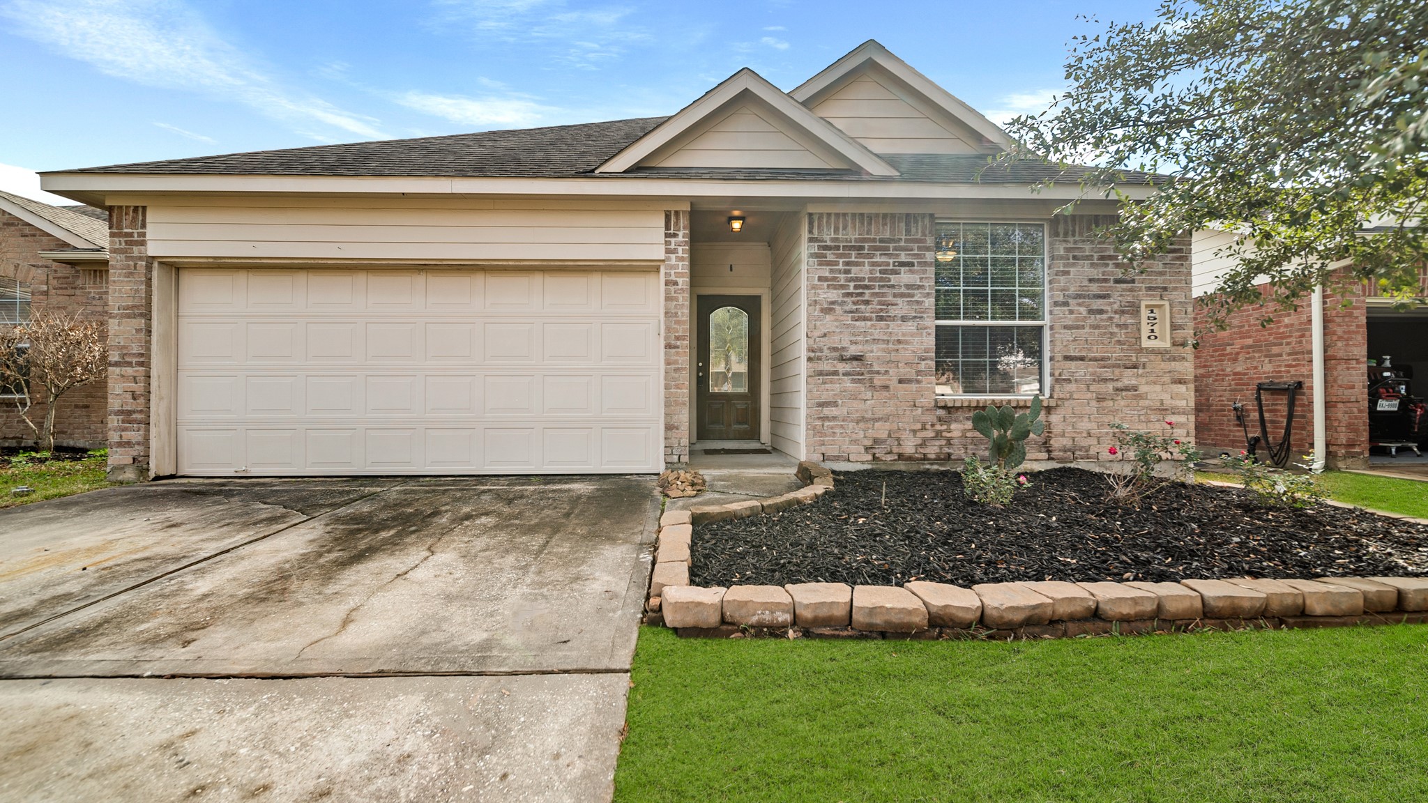 15710 Flagstone Walk Way Houston, TX 77049 - Photo 22 of 27 a front view of a house with a yard