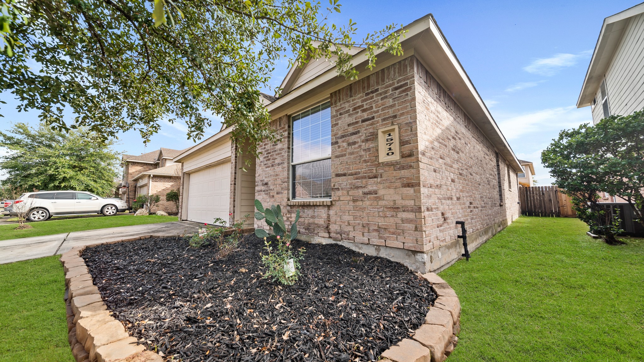 15710 Flagstone Walk Way Houston, TX 77049 - Photo 26 of 27 a view of a house with a yard