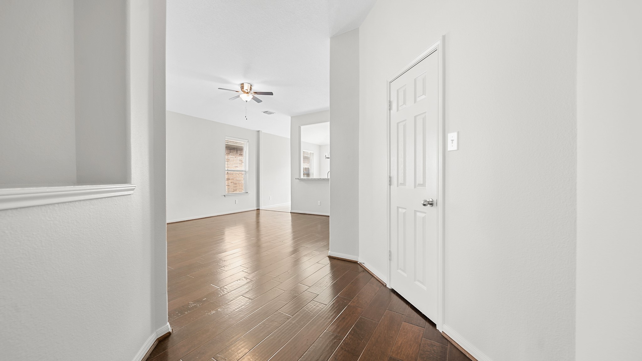 15710 Flagstone Walk Way Houston, TX 77049 - Photo 3 of 27 a view of a hallway with wooden floor