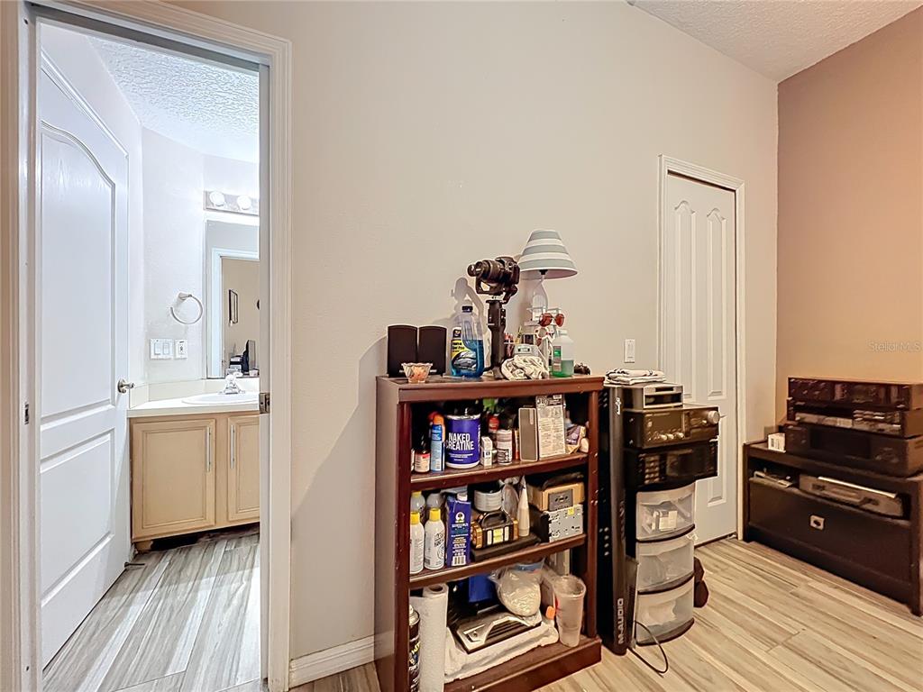 676 Sandy Neck Lane, Unit 101 Altamonte Springs, FL 32714 - Photo 12 of 24 a view of a workspace with furniture and wooden floor