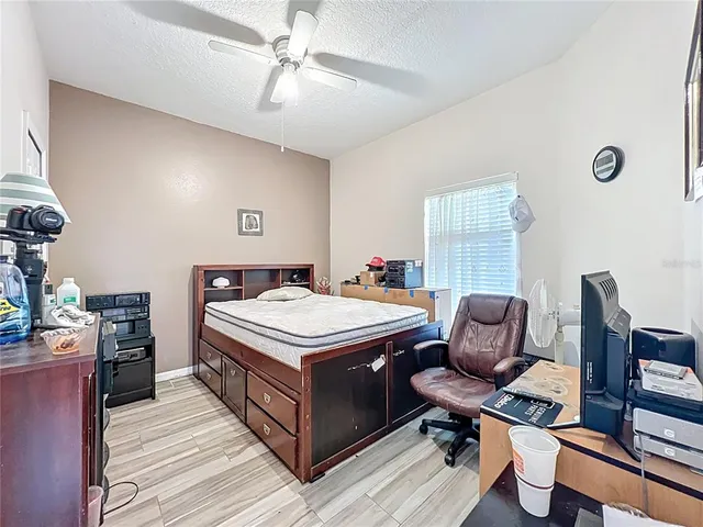 a view of livingroom with workspace and a window