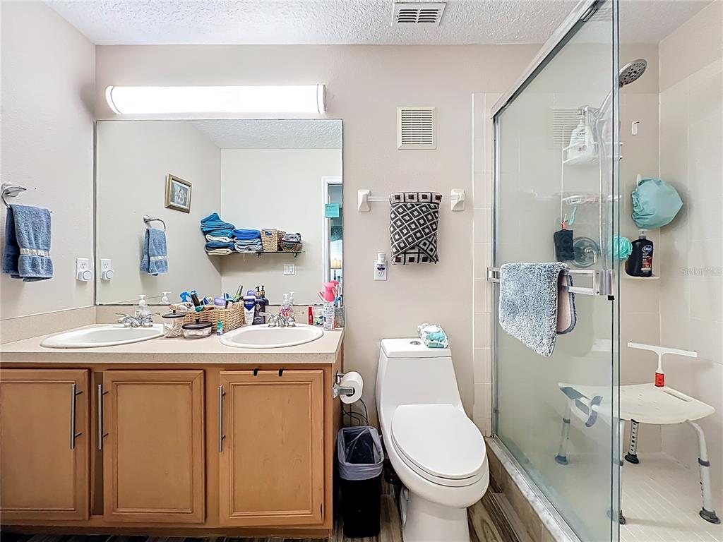 676 Sandy Neck Lane, Unit 101 Altamonte Springs, FL 32714 - Photo 15 of 24 a bathroom with a sink toilet and shower