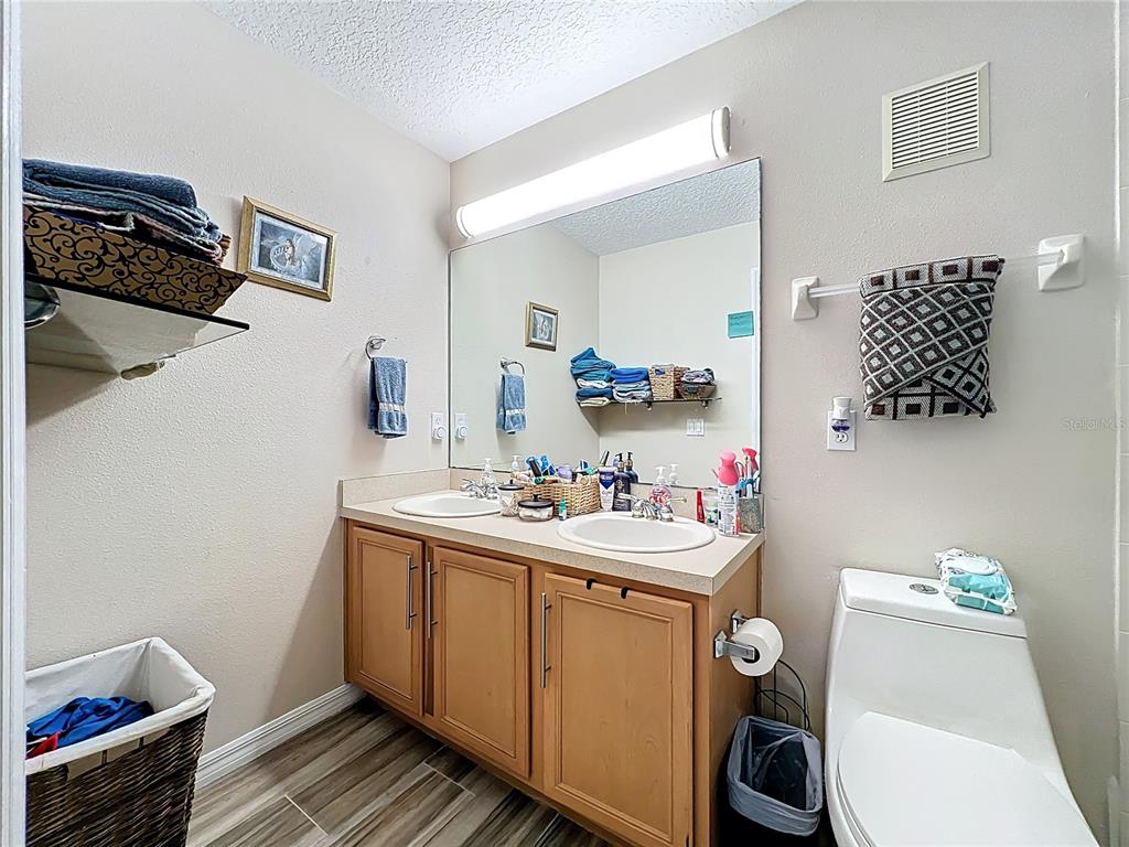 676 Sandy Neck Lane, Unit 101 Altamonte Springs, FL 32714 - Photo 18 of 24 a view of bathroom sink and toilet