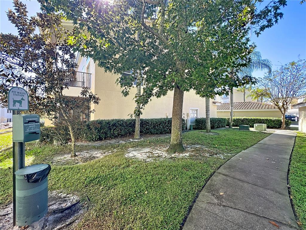 676 Sandy Neck Lane, Unit 101 Altamonte Springs, FL 32714 - Photo 19 of 24 a view of a garden with a tree