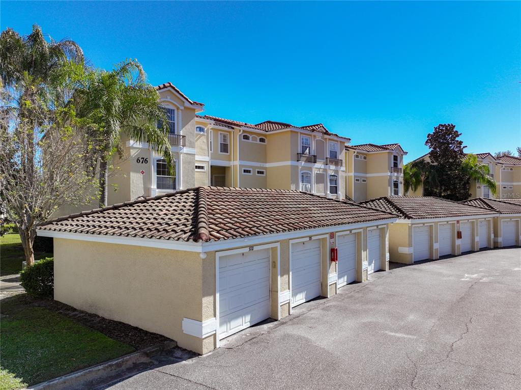 676 Sandy Neck Lane, Unit 101 Altamonte Springs, FL 32714 - Photo 20 of 24 a front view of a house with a yard