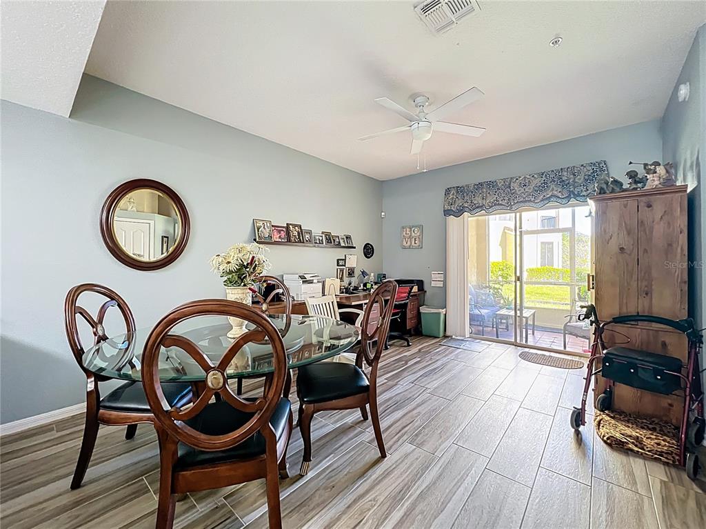 676 Sandy Neck Lane, Unit 101 Altamonte Springs, FL 32714 - Photo 7 of 24 a view of a dining room with furniture window and wooden floor