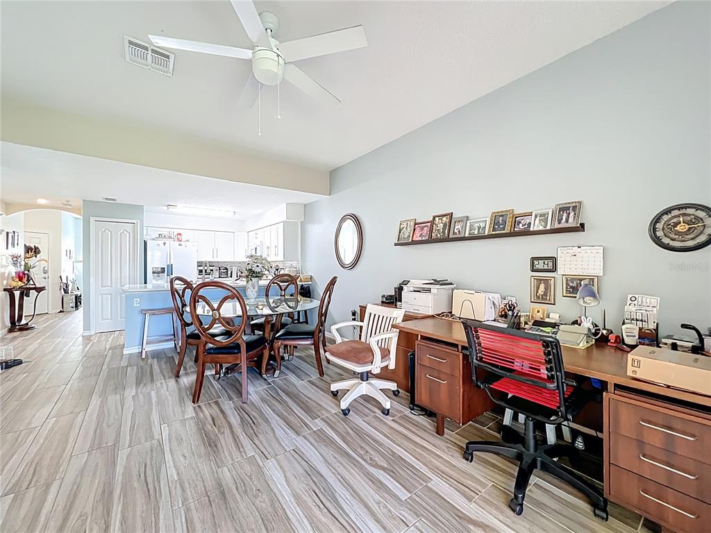 676 Sandy Neck Lane, Unit 101 Altamonte Springs, FL 32714 - Photo 8 of 24 a living room with furniture wooden floor and a window