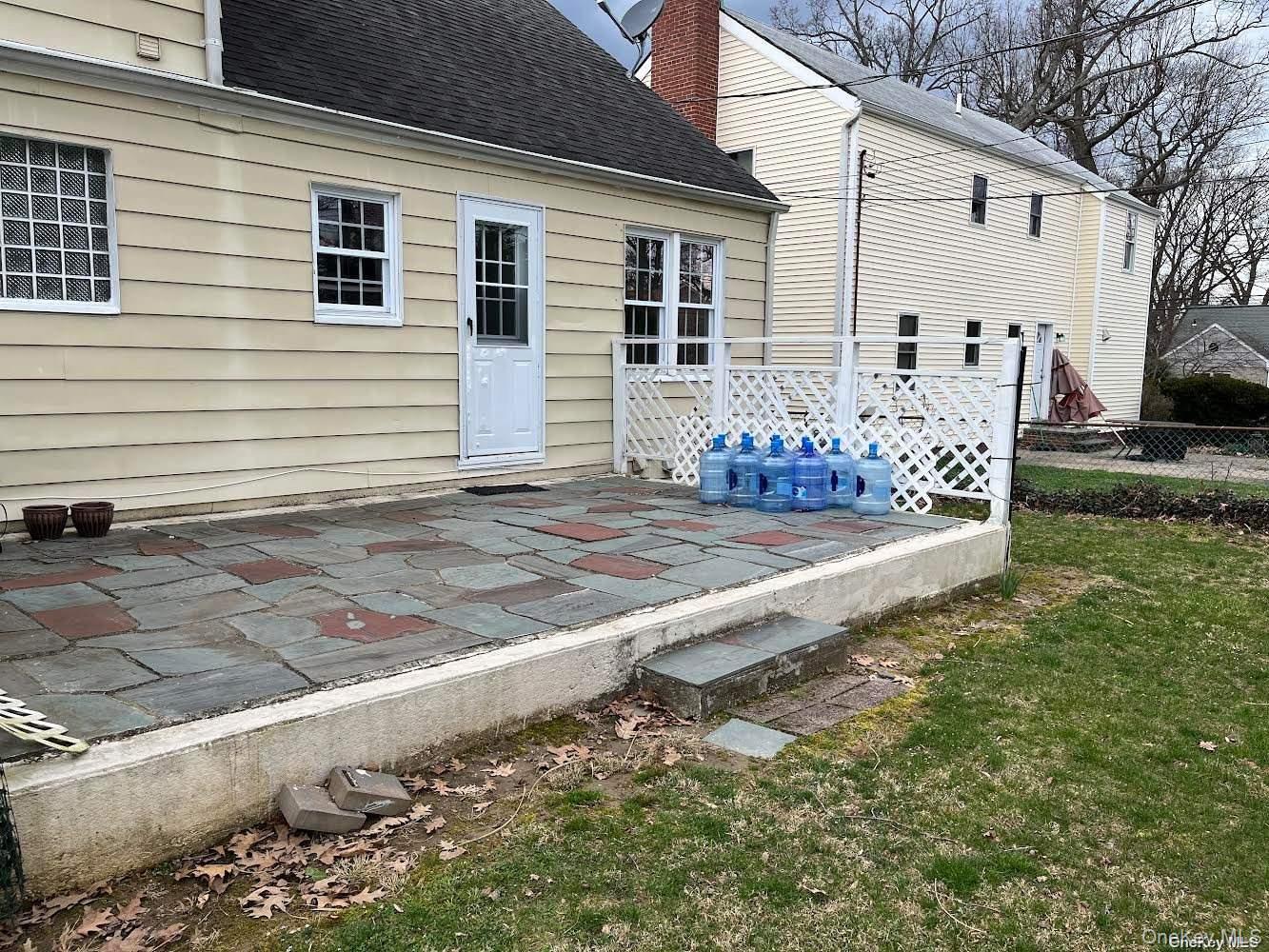 26 Purdue Road Glen Cove, NY 11542 - Photo 13 of 17 Patio off kitchen door