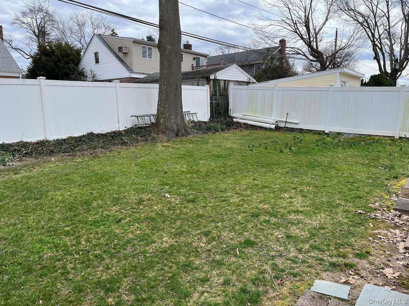 26 Purdue Road Glen Cove, NY 11542 - Photo 14 of 17 Backyard fenced in