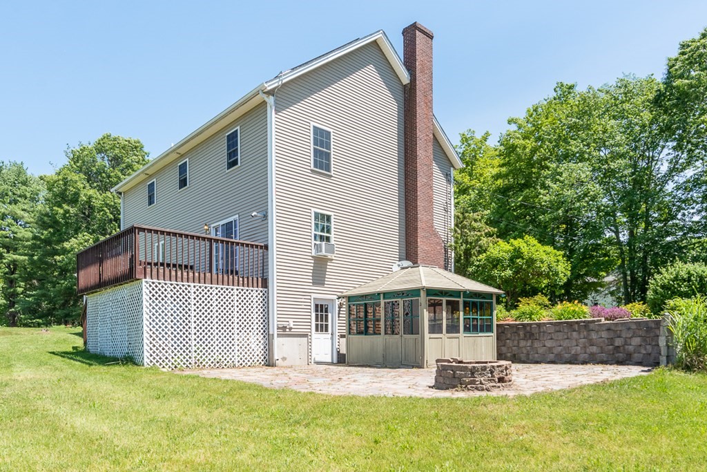 90 Benjamin Road Shirley, MA 01464 - Photo 27 of 41 a front view of a house with a yard