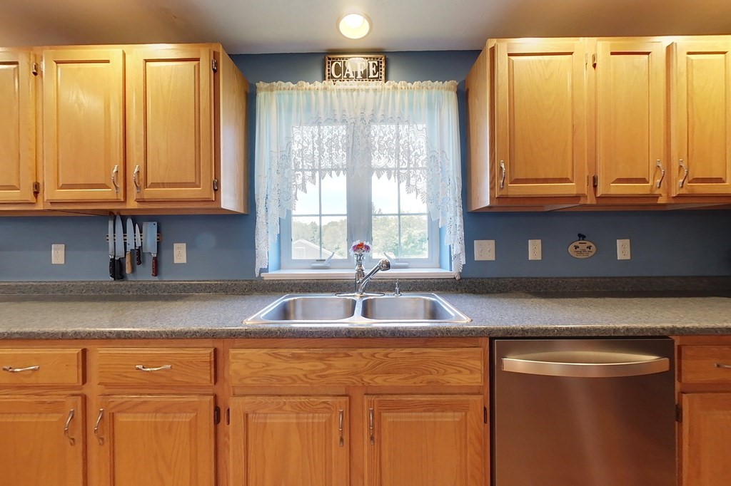90 Benjamin Road Shirley, MA 01464 - Photo 3 of 41 a kitchen with granite countertop a sink and a window