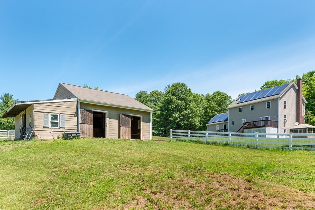 90 Benjamin Road Shirley, MA 01464 - Photo 31 of 41 a house view with a garden space
