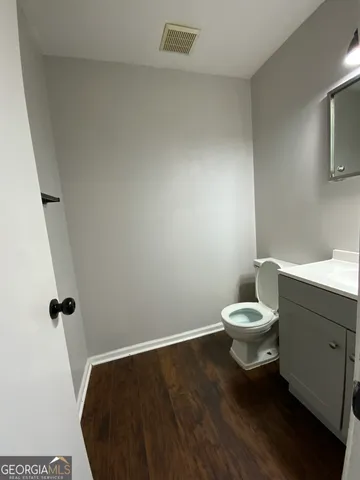 a bathroom with a toilet and a sink