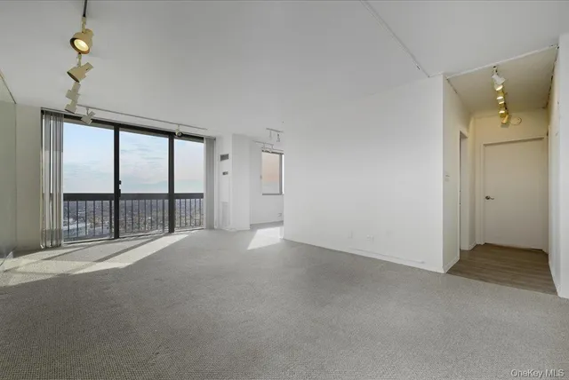 a view of an empty room with a window