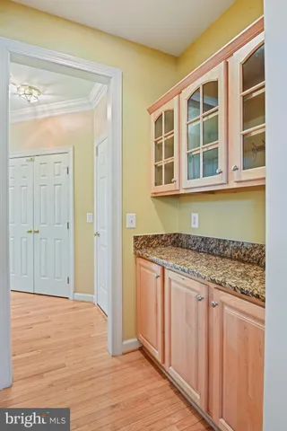 a living room with fireplace furniture and a large window