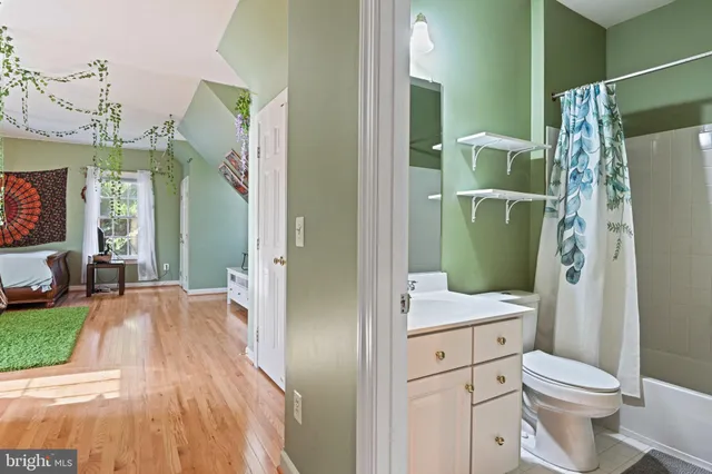 a bath room with a bathtub and a potted plant