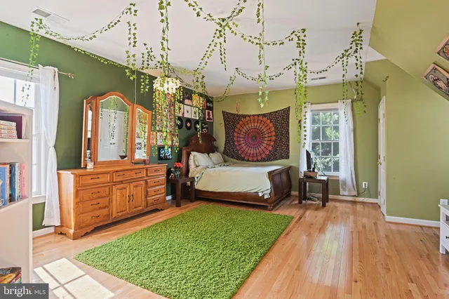 a bathroom with a sink a toilet a mirror and vanity