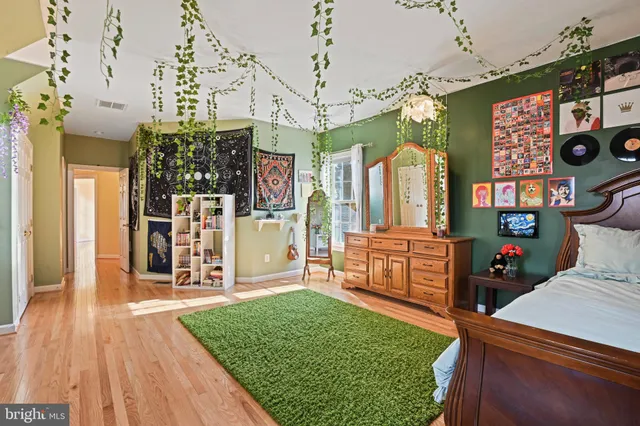 a bedroom with bed and window