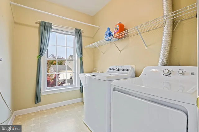 a bathroom with a sink toilet vanity and tub