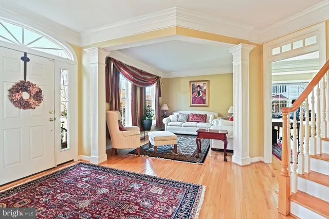 a living room with furniture and a rug