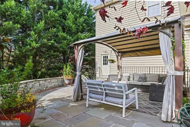 a backyard of a house with outdoor seating
