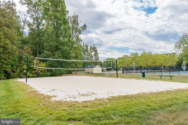 a view of a swimming pool with a yard