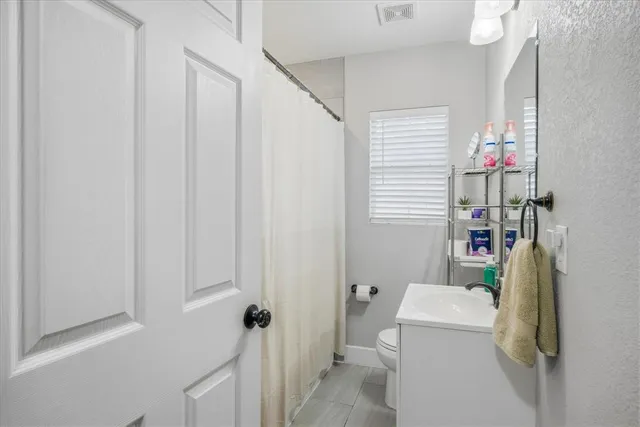 a bedroom with a bed and a table in it