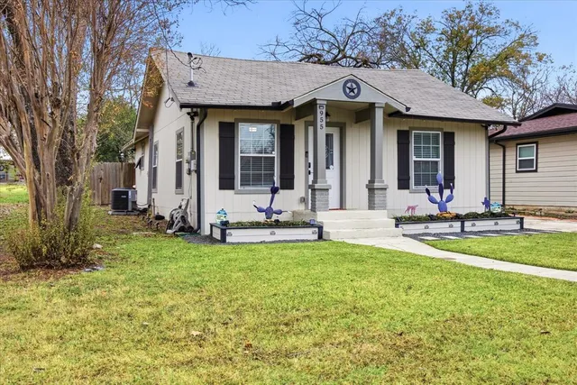 a view of a house with backyard porch and sitting area