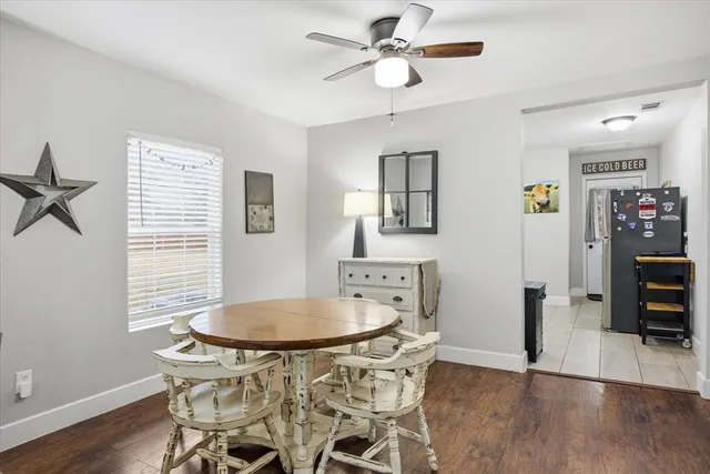 a dining room with furniture and window