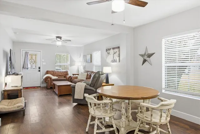 a view of a dining room with furniture and wooden floor