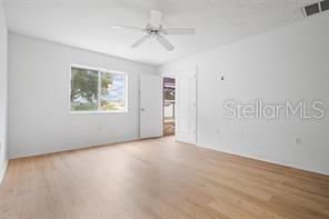 2324 Potomac Mark Place Ruskin, FL 33570 - Photo 11 of 38 an empty room with windows and fan