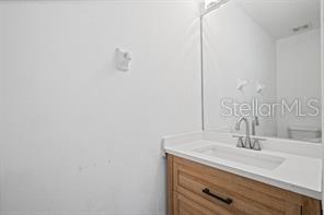 2324 Potomac Mark Place Ruskin, FL 33570 - Photo 17 of 38 a bathroom with a sink and a mirror